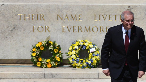 Prime Minister Scott Morrison lays a wreath during Remembrance Day at the Australian War Memorial.