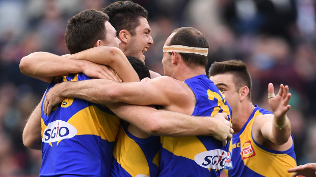 West Coast players celebrate their 2018 premiership... can they go back-to-back in 2019?