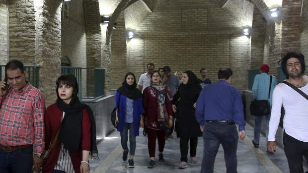 People walk at the old main bazaar in Tehran, Iran.