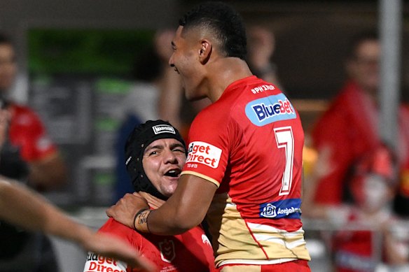 Kodi Nikorima and Isaiya Katoa celebrate a try for the Dolphins.