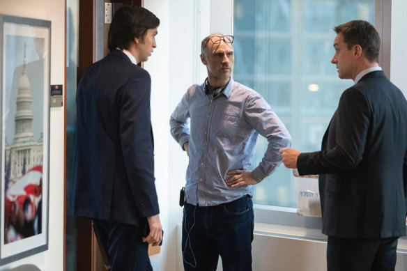 Jesse Armstrong (centre) directs Nicholas Braun (Greg, left) and Matthew Macfadyen (Tom, right) on the set of the final season of Succession.