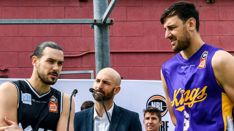 Melbourne United guard Chris Goulding (centre left) and Sydney Kings center Andrew Bogut (right) at the pre-season NBL jersey launch.