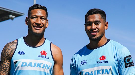 Big brothers: Israel and john Folau pose for a photo before the Waratahs' match against the Sunwolves in round seven. 