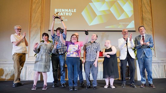 Members of Back to Back Theatre accept the prestigious Golden Lion for lifetime achievement.