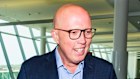 Peter Dutton speaks to journalists as he makes his way through Canberra Airport.