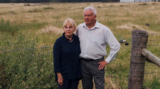 Bev and Graham Hordern at home in Moss Vale. Over their shoulder is the site of what may become the nation’s largest plastic recycling facility.