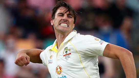Australia’s Pat Cummins celebrates trapping England’s Joe Root LBW in Hobart.