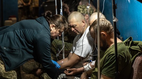 Members of the Ukrainian military receive treatment for concussions and light injuries from Ukrainian military medics at a frontline field hospital in Popasna, Ukraine.
