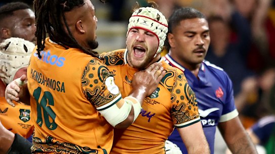 Fraser McReight celebrates a try.