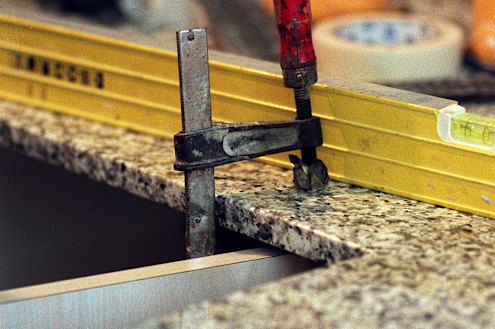 Crystalline silica, or quartz, is found in natural and manufactured stone often used for kitchen benchtops.