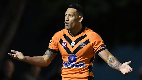 Israel Folau in action for the Southport Tigers league team in 2021. His sacking after posting homophobic memes on social media has had significant repercussions.