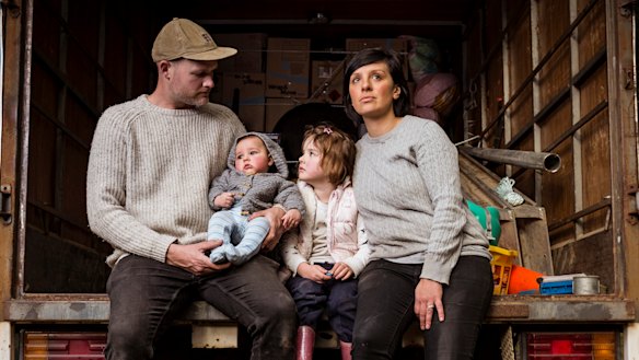 Dani Venn, husband Chris Burgess and their children, Oscar and Harlow, pack up their belongings.