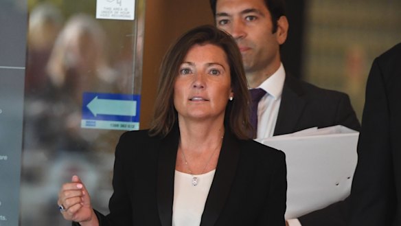 Human Group director Helen Rosamond leaves the Downing Centre Local Court in Sydney after being charged. 