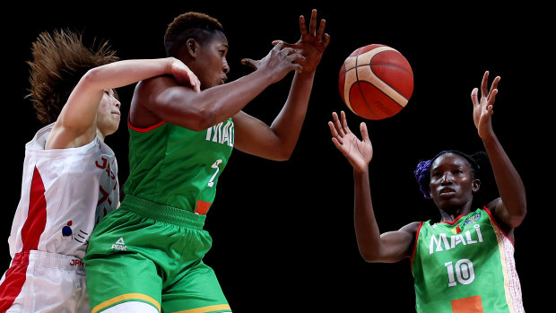 Salimatou Kourouma and Maimouna Haidara look to secure a rebound in Mali’s game with Japan earlier in the World Cup tournament.