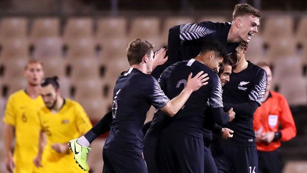 New Zealand celebrate Clayton Lewis's equaliser against the Olyroos.