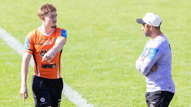 Lachie Galvin and coach Benji Marshall at Tigers training.