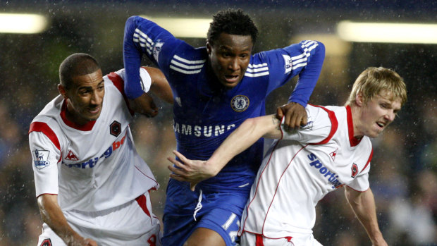 Second chance: Andy Keogh, right, tries to block the path of Chelsea's John Obi Mikel for Wolverhampton Wanderers in 2009.