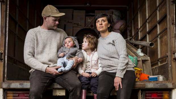 Dani Venn, husband Chris Burgess and their children, Oscar and Harlow, pack up their belongings.