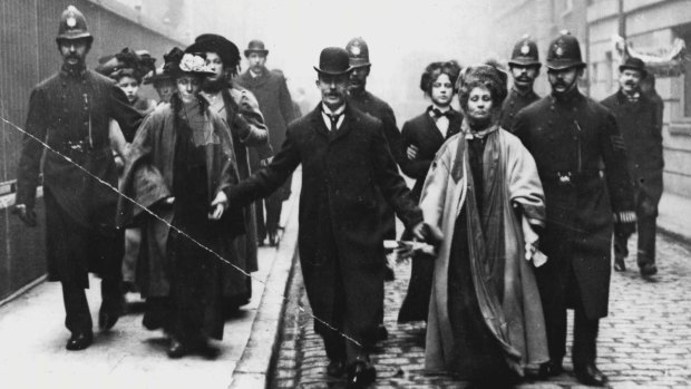 Emmeline Pankhurst (left) under arrest in May 1908.