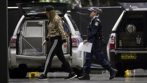 Stephanie Korfiatis in the company of NSW Police officers outside the Above & Beyond music event  at the Sydney Showgrounds.