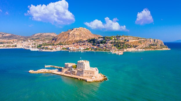 The romantic seaside Greek city of Nafplio is distinguished by its tiled rooftops, castle and fortress.