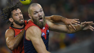 Zac attack: Zac Clarke and Max Gawn in the ruck.