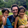 Scott McIntyre with his children in Japan.