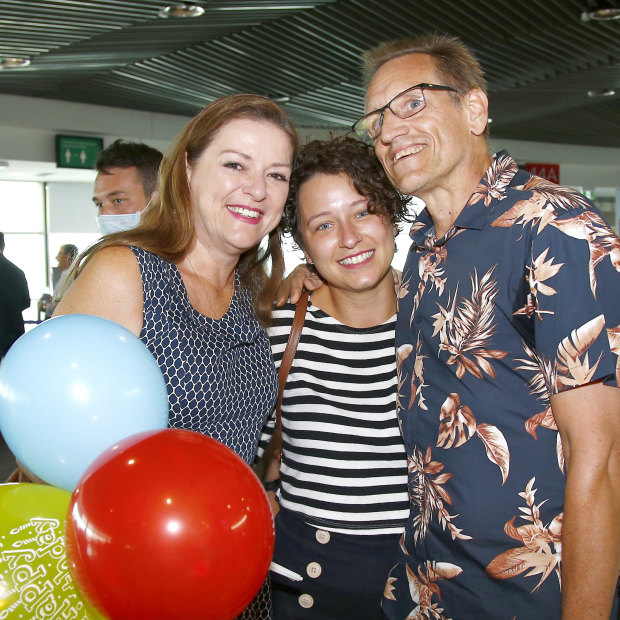 Graham and Natalie Auchterlonie welcome daughter Katherine at Brisbane Airport. 