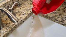 Boiling water is recommended over drain cleaning products as they can cause damage to seals in pipes.