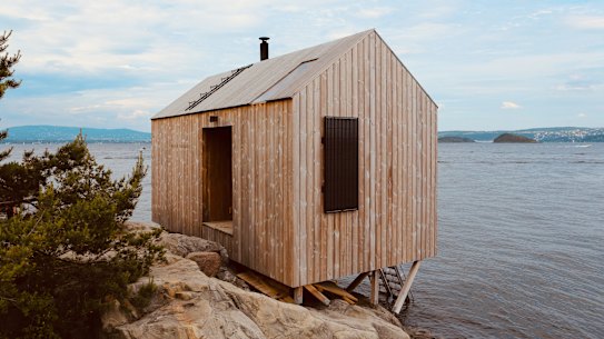 A sauna on the edge of the coast in Nesodden, Norway. On the other side of the fjord is Oslo, the capital of Norway. Outdoor, public saunas are increasingly popular in Norway. Oslo sauna story by Julie Lewis, Traveller Credit: Getty