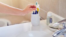 Toothbrush holders should be cleaned as part of a regular bathroom cleaning routine.