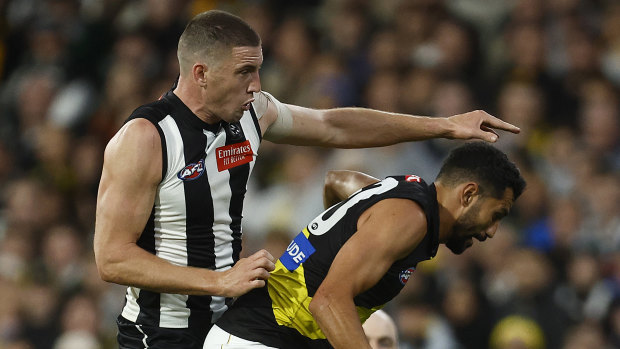 Darcy Cameron, left, and Marlion Pickett contest the ball during round three. 