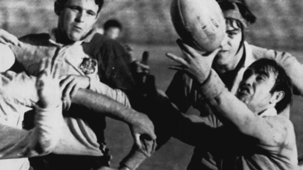 Mick Barry (right) playing for the Wallabies in 1966.
