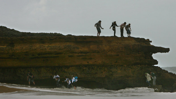 Paddle if you dare. Tourists test the water at Bells Beach.