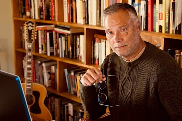 Stan Grant with his “armour”, his wall of books.
