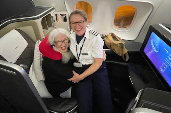 Reader Geraldine Herbert-Brown with the captain of her British Airways flight.