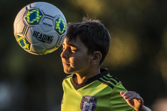 Alex Nitsas, 7, from the Ashfield Pirates, practises heading with a special soft ball.