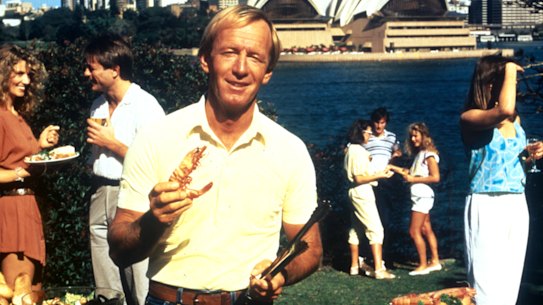 Paul Hogan with his shrimp and barbie in the 1984 Tourism Australia campaign “Come say G’Day”. 