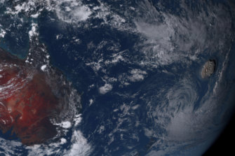 An underwater volcanic eruption, on the right, off the Pacific nation of Tonga on Saturday.