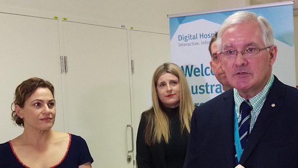 Dr Richard Ashby, right, speaks to the media in March.