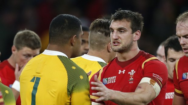 Warburton shakes hands with Scott Sio after a Rugby World Cup match in 2015.