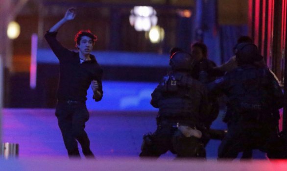 19-year old hostage Jarrod Morton-Hoffman flees from the Lindt  Cafe in Martin Place.