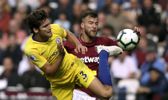 Chelsea's Marcos Alonso and West Ham's Andriy Yarmolenko compete for the ball at London Stadium on Sunday.