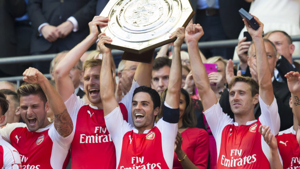 Arteta, centre, lifts the Community Shield trophy after Arsenal beat Chelsea 1-0 at Wembley Stadium in 2015.