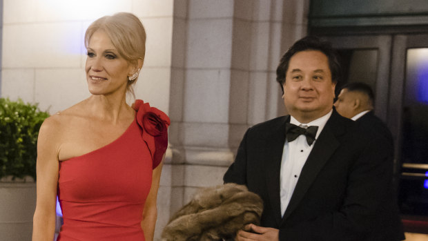 Kellyanne Conway and her husband, George, arrive for a dinner at Union Station in Washington, the day before Trump's inauguration in 2017.