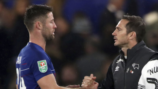 Chelsea defender Gary Cahill (left) and Lampard shake hands after the match.