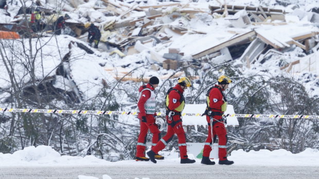 Rescue crews work in the area at Ask in Gjerdrum, Saturday January 2, 2021, after a massive landslide smashed into a residential area near the Norwegian capital on Wednesday.