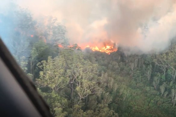 Vision taken during aerial firefighting efforts against the bushfire in early December after Queensland Fire and Emergency Services took over management of the blaze.
