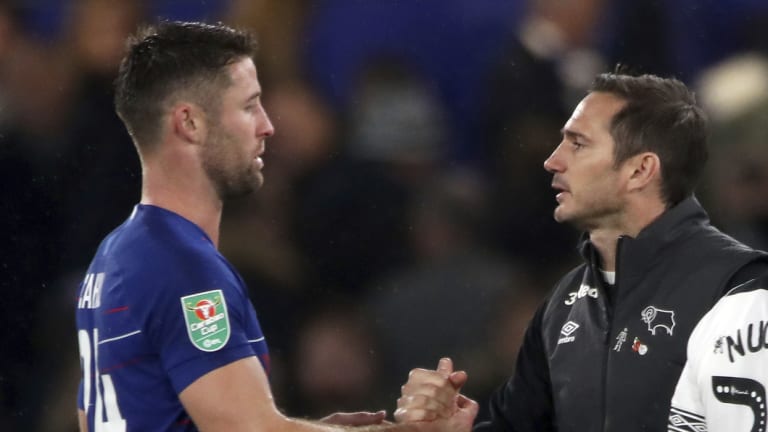 Chelsea defender Gary Cahill (left) and Lampard shake hands after the match.