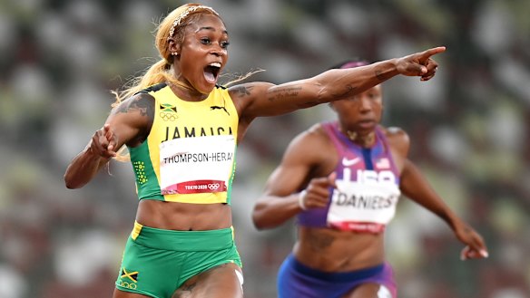 Elaine Thompson-Herah celebrates her gold.